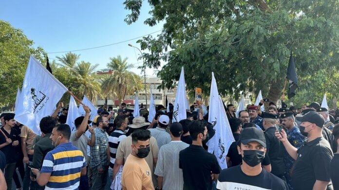 Supporters of Iraqi Shiite factions demonstrate in protest against America