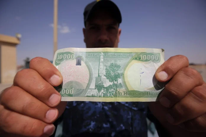 “To withstand change and fluctuation and be recognized internationally” .. The government lists the difficulties of replacing the dinar with the dollar through oil sales