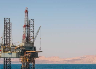 Oil prices settle down as US stockpile grows, tariffs still in focus