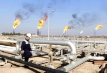 Oil falls but is on track for a third weekly gain.