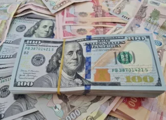 A slight rise in the dollar exchange rate against the Iraqi dinar in Baghdad.