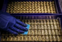 Precious metals fall again, Asian stocks swing as traders wind down