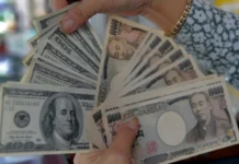 Dollar sinks on yen intervention talk, gold breaks $5,000