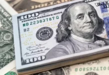 The dollar hits its lowest level in four years.