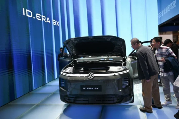 Volkswagen warns of more cost cuts as profits plunge
