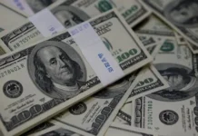 The dollar is heading for its biggest weekly gain in two months.