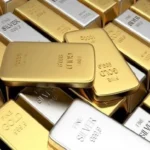 Gold is heading for its biggest weekly loss in more than four months as oil prices rise.