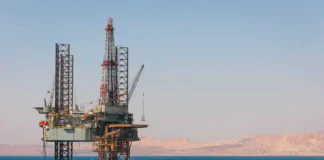 Oil prices settle down as US stockpile grows, tariffs still in focus